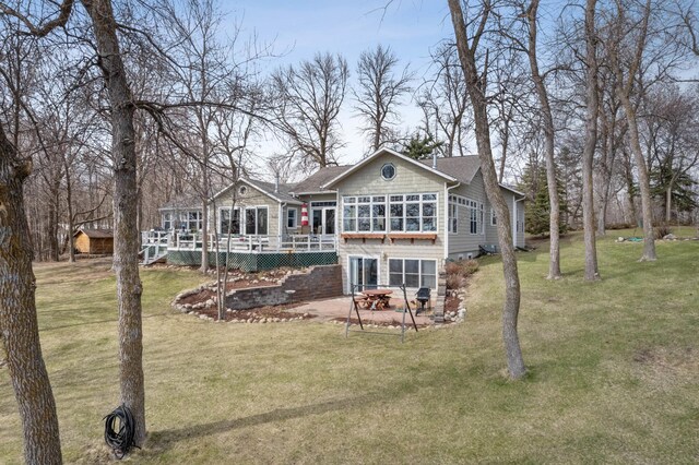 32331 Loon Dr, Candor Twp, MN 56587 - back of property with a yard, a deck, and a patio area
