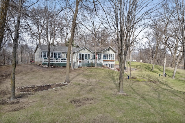 32331 Loon Dr, Candor Twp, MN 56587 - view of front of house featuring a front lawn and a deck