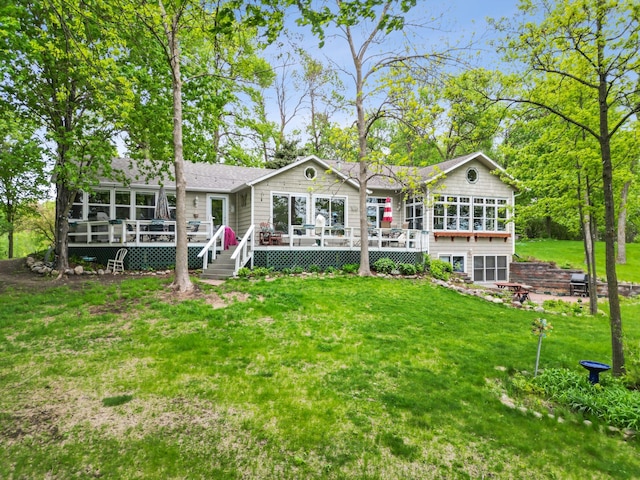 32331 Loon Dr, Candor Twp, MN 56587 - back of house with a deck, a lawn, and a shingled roof