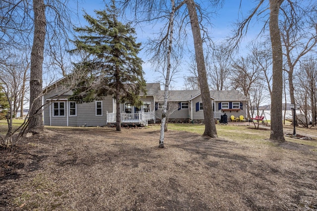 32331 Loon Dr, Candor Twp, MN 56587 - view of front facade featuring a wooden deck and roof with shingles