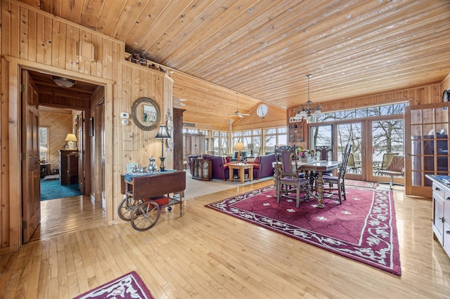 32331 Loon Dr, Candor Twp, MN 56587 - dining space with wood walls, hardwood / wood-style flooring, a chandelier, wooden ceiling, and french doors