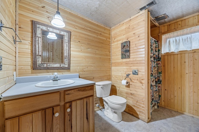 32331 Loon Dr, Candor Twp, MN 56587 - bathroom with an ornate ceiling, wood walls, vanity, toilet, and tile patterned floors