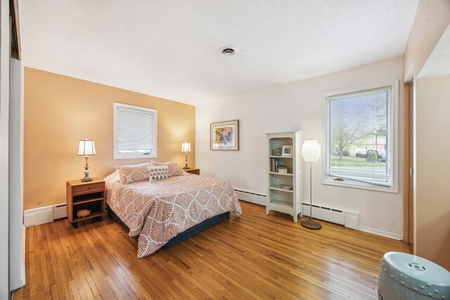 5427 Twin Lake Blvd E, Brooklyn Center, MN 55429 - bedroom with light wood-style flooring and baseboards