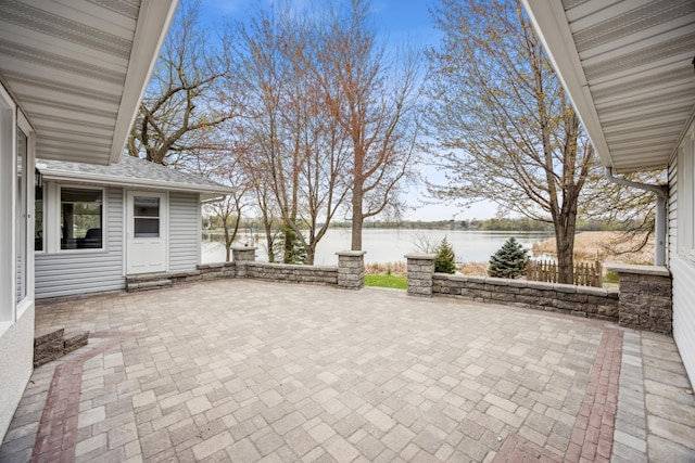 5427 Twin Lake Blvd E, Brooklyn Center, MN 55429 - view of patio featuring a water view