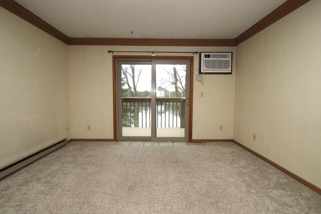 spare room featuring carpet floors, baseboards, ornamental molding, and a wall mounted air conditioner