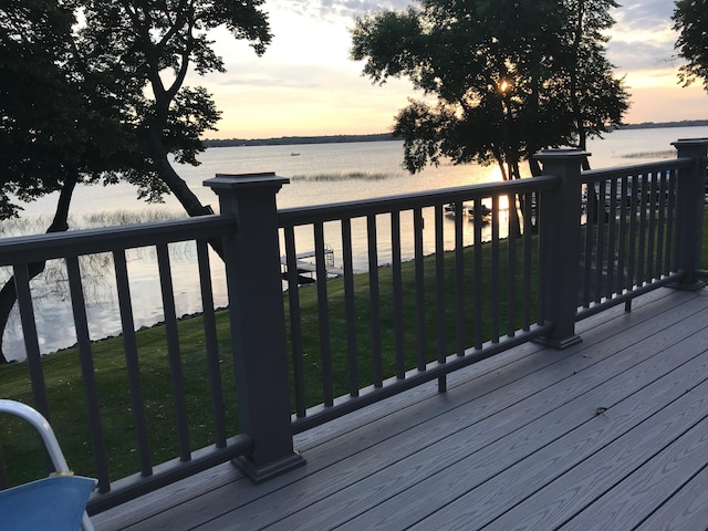 wooden deck featuring a water view