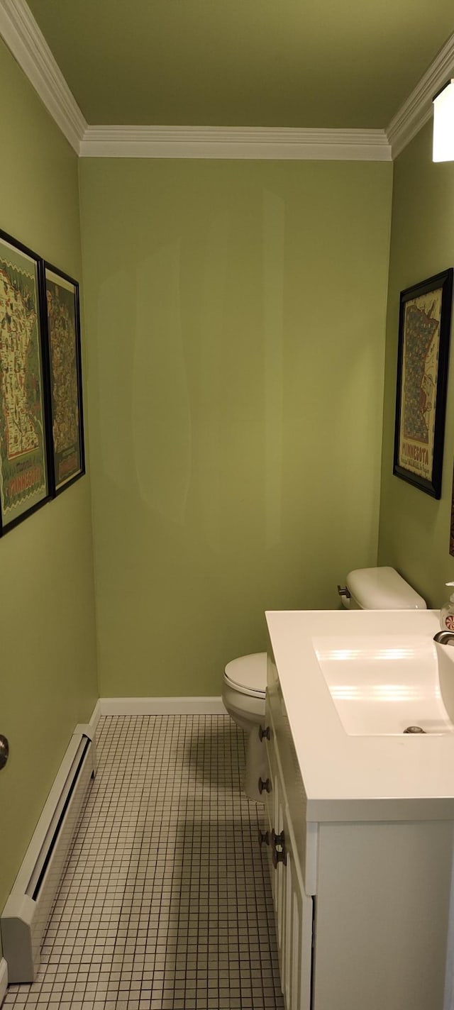 2520 Le Homme Dieu Hts NE Unit 3, Alexandria Twp, MN 56308 - half bath featuring a baseboard heating unit, crown molding, toilet, vanity, and tile patterned flooring