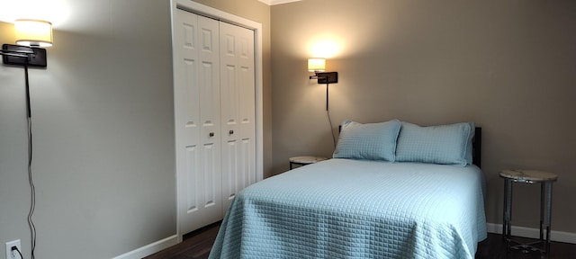 2520 Le Homme Dieu Hts NE Unit 3, Alexandria Twp, MN 56308 - bedroom with a closet, dark wood-type flooring, baseboards, and ornamental molding
