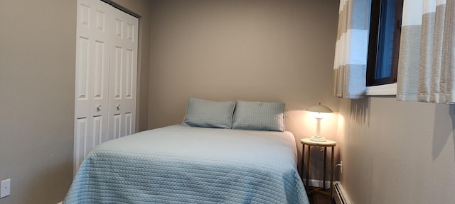 2520 Le Homme Dieu Hts NE Unit 3, Alexandria Twp, MN 56308 - bedroom with a closet, a baseboard radiator, and baseboards