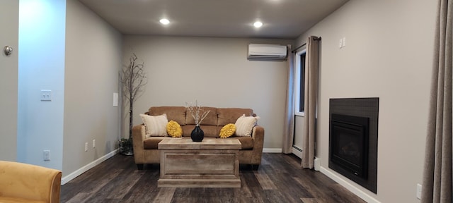 2520 Le Homme Dieu Hts NE Unit 3, Alexandria Twp, MN 56308 - living area with a wall unit AC, dark wood-type flooring, recessed lighting, baseboards, and a glass covered fireplace