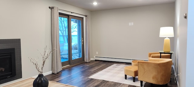 2520 Le Homme Dieu Hts NE Unit 3, Alexandria Twp, MN 56308 - sitting room featuring a fireplace, baseboard heating, wood finished floors, baseboards, and recessed lighting