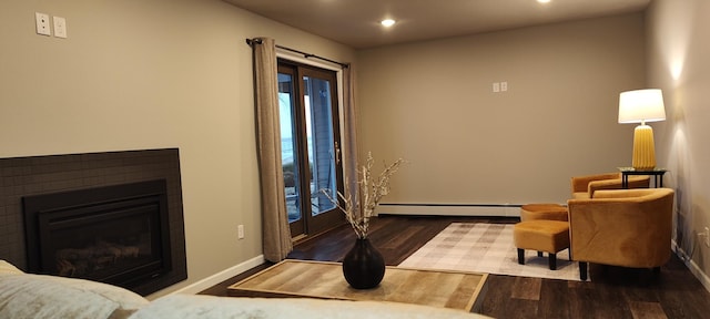 2520 Le Homme Dieu Hts NE Unit 3, Alexandria Twp, MN 56308 - living room with recessed lighting, wood finished floors, a baseboard radiator, baseboards, and a glass covered fireplace