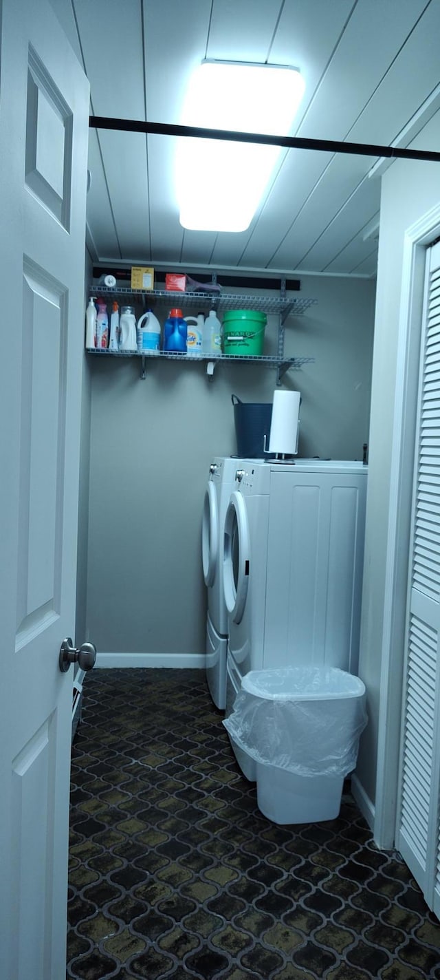 2520 Le Homme Dieu Hts NE Unit 3, Alexandria Twp, MN 56308 - washroom featuring washing machine and dryer, dark stone finish floors, and baseboards