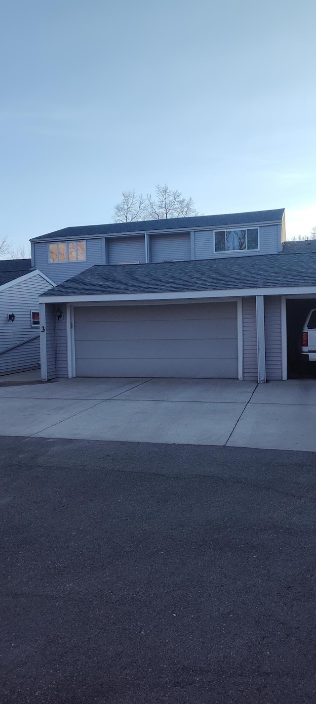 2520 Le Homme Dieu Hts NE Unit 3, Alexandria Twp, MN 56308 - view of front of house featuring driveway and roof with shingles