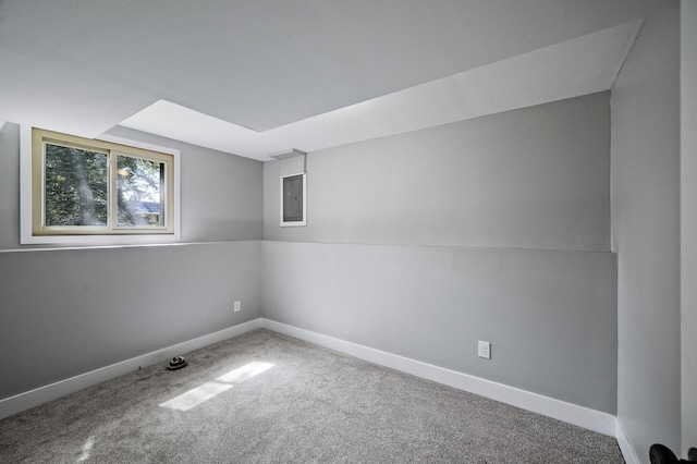 spare room with carpet floors and baseboards