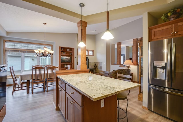 7232 Kestrel Trl, Savage, MN 55378 - kitchen with stainless steel refrigerator with ice dispenser, a kitchen breakfast bar, light wood-style flooring, pendant lighting, and lofted ceiling