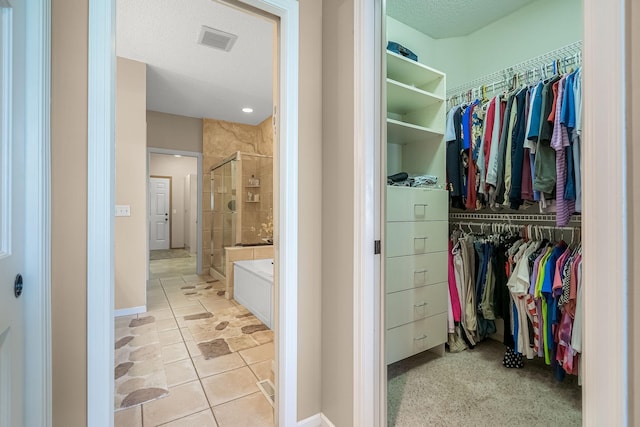 7232 Kestrel Trl, Savage, MN 55378 - spacious closet featuring tile patterned flooring