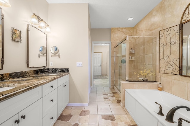 7232 Kestrel Trl, Savage, MN 55378 - bathroom featuring a stall shower, double vanity, and a garden tub
