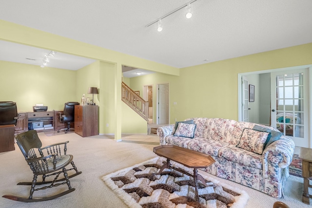 7232 Kestrel Trl, Savage, MN 55378 - living area with rail lighting, carpet flooring, stairway, and an office area