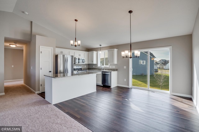 1102 2nd St NW, Delano, MN 55328 - kitchen with stainless steel appliances, a notable chandelier, and vaulted ceiling