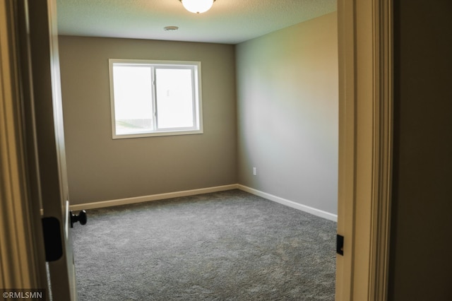 1102 2nd St NW, Delano, MN 55328 - unfurnished room featuring carpet floors, a textured ceiling, and baseboards