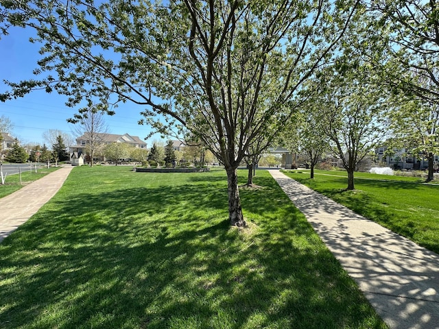 surrounding community featuring a lawn