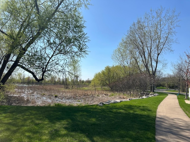 surrounding community featuring a yard