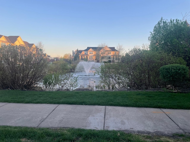 view of home's community featuring a yard