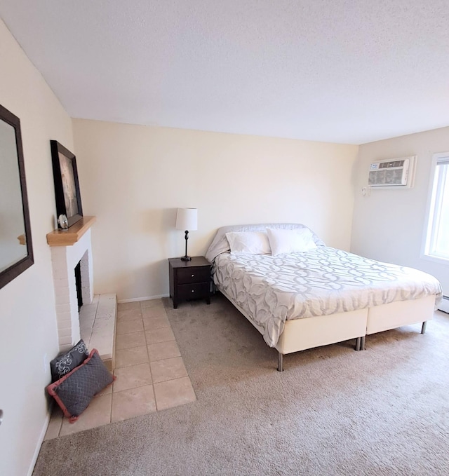 4860 Park Commons Dr Unit 314, Saint Louis Park, MN 55416 - carpeted bedroom with a wall mounted air conditioner, a fireplace, and tile patterned floors