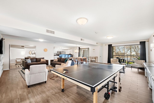 4860 Park Commons Dr Unit 314, Saint Louis Park, MN 55416 - game room with light wood-style flooring and baseboards