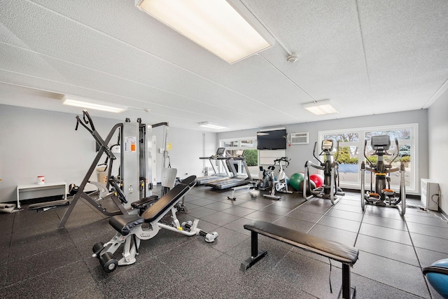 4860 Park Commons Dr Unit 314, Saint Louis Park, MN 55416 - gym featuring a wall unit AC and a textured ceiling