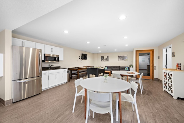 4860 Park Commons Dr Unit 314, Saint Louis Park, MN 55416 - dining room featuring light wood-type flooring and recessed lighting