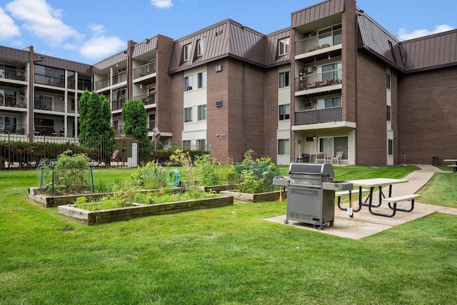 4860 Park Commons Dr Unit 314, Saint Louis Park, MN 55416 - view of home's community featuring a vegetable garden and a lawn
