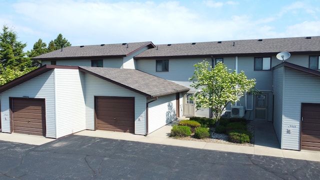 29465 422nd Ave, Otter Tail Twp, MN 56515 - multi unit property featuring a shingled roof, a detached garage, and a cooling unit