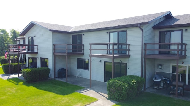 29465 422nd Ave, Otter Tail Twp, MN 56515 - rear view of house featuring a patio, a yard, and roof with shingles