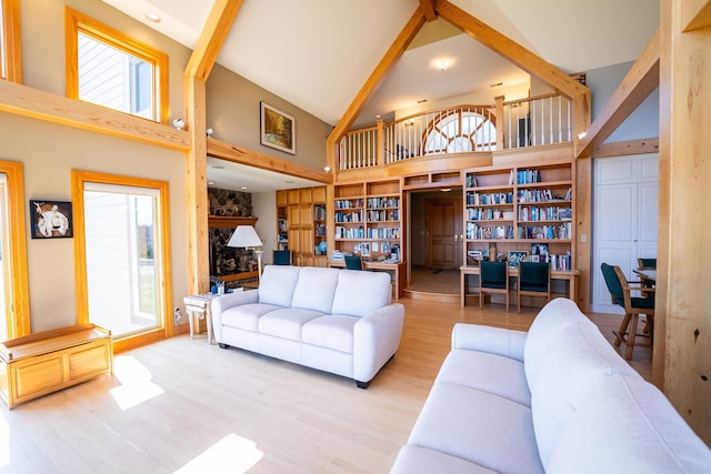 2300 County Road 92, Minnetrista, MN 55359 - living area featuring high vaulted ceiling, plenty of natural light, wood finished floors, and beam ceiling