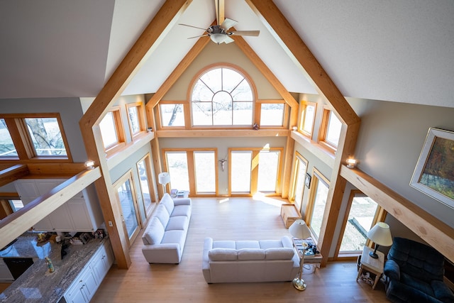 2300 County Road 92, Minnetrista, MN 55359 - living room with high vaulted ceiling, light wood-style floors, beam ceiling, and a ceiling fan