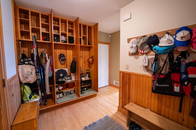 2300 County Road 92, Minnetrista, MN 55359 - mudroom with wainscoting, wood finished floors, and wood walls
