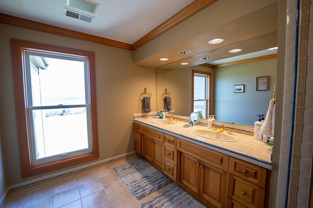 2300 County Road 92, Minnetrista, MN 55359 - bathroom with crown molding, double vanity, plenty of natural light, tile patterned floors, and recessed lighting
