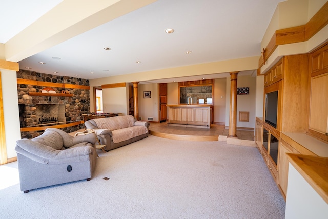 2300 County Road 92, Minnetrista, MN 55359 - living room featuring ornate columns, a fireplace, light carpet, healthy amount of natural light, and recessed lighting