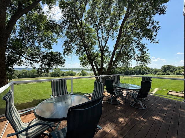 2300 County Road 92, Minnetrista, MN 55359 - deck featuring outdoor dining space, a yard, and a water view