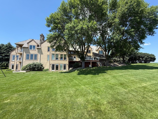2300 County Road 92, Minnetrista, MN 55359 - back of property featuring a chimney and a lawn