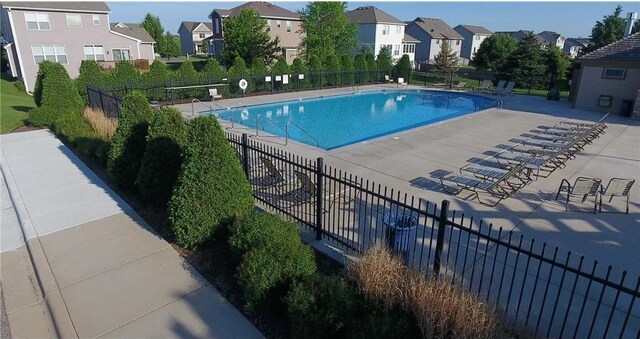 1001 Stone Creek Dr, Jordan, MN 55352 - community pool featuring a residential view and fence