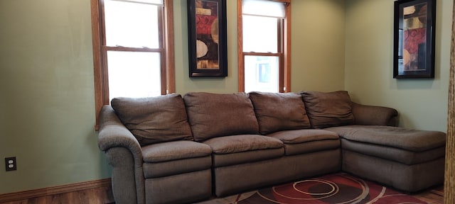 living room with wood finished floors and baseboards