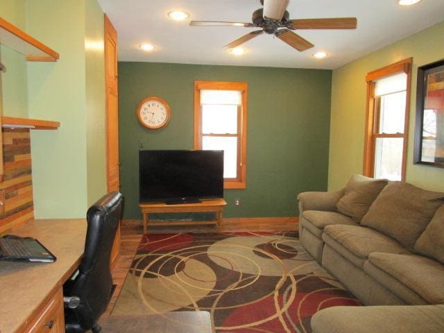 living room with ceiling fan, recessed lighting, wood finished floors, and an office area