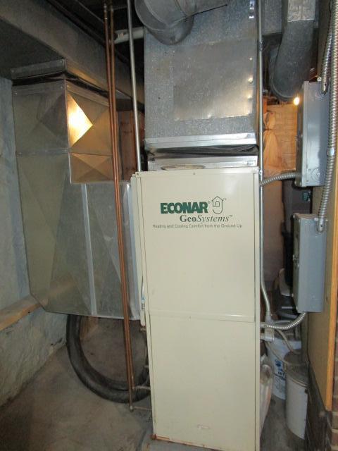 utility room with heating unit