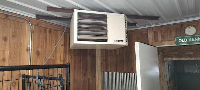 detailed view of wooden walls and a heating unit