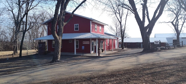 view of front of house featuring a porch and metal roof