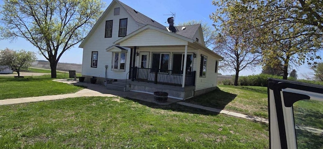 bungalow-style home featuring a porch and a front yard