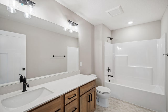 bathroom with toilet, shower / washtub combination, and vanity